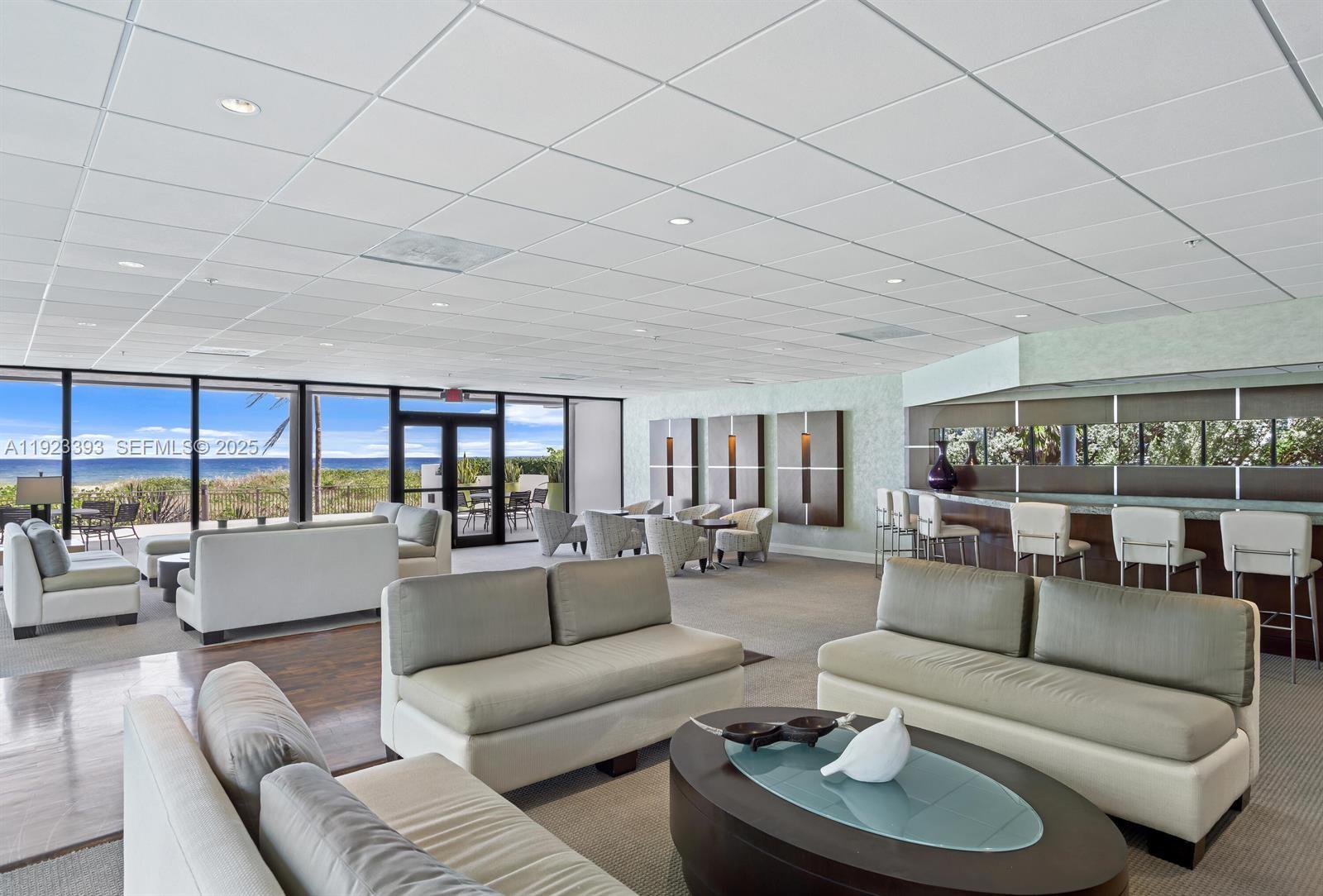 1800 South Ocean Boulevard, Unit 5C Boca Raton, FL 33432 - Photo 41 of 98 a living room with furniture and a large window