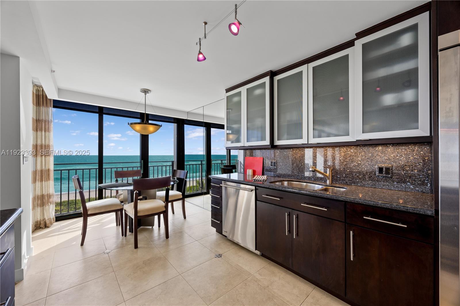 1800 South Ocean Boulevard, Unit 5C Boca Raton, FL 33432 - Photo 63 of 98 a open kitchen with a sink and cabinets
