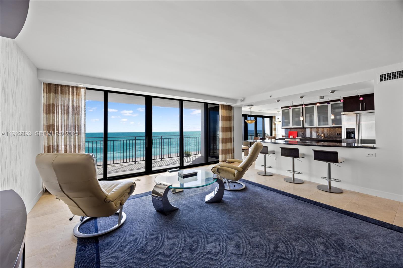 1800 South Ocean Boulevard, Unit 5C Boca Raton, FL 33432 - Photo 67 of 98 a living room with furniture and a flat screen tv