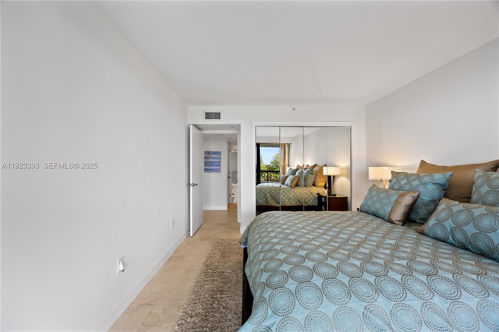 1800 South Ocean Boulevard, Unit 5C Boca Raton, FL 33432 - Photo 69 of 98 a bedroom with a large bed and a couch