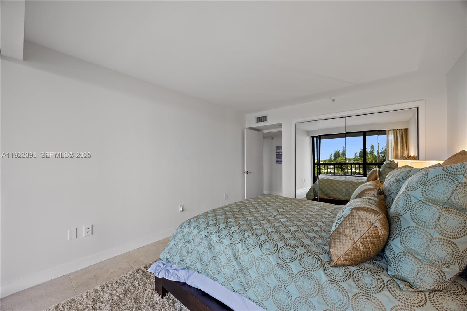 1800 South Ocean Boulevard, Unit 5C Boca Raton, FL 33432 - Photo 70 of 98 a bedroom with a bed and a window
