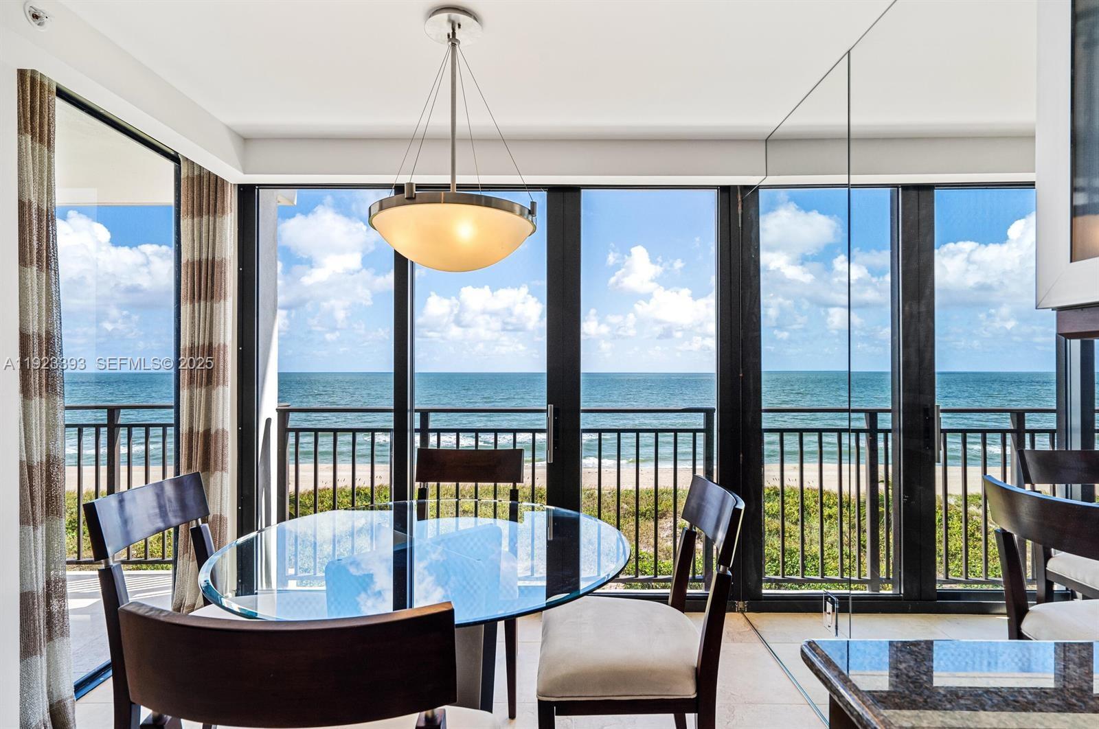 1800 South Ocean Boulevard, Unit 5C Boca Raton, FL 33432 - Photo 7 of 98 a dining room with furniture a chandelier and fireplace