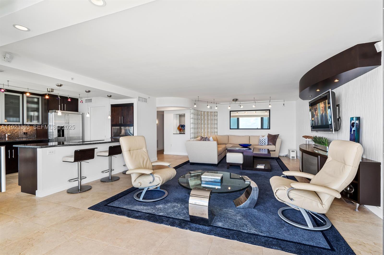1800 South Ocean Boulevard, Unit 5C Boca Raton, FL 33432 - Photo 8 of 98 a living room with furniture and kitchen view