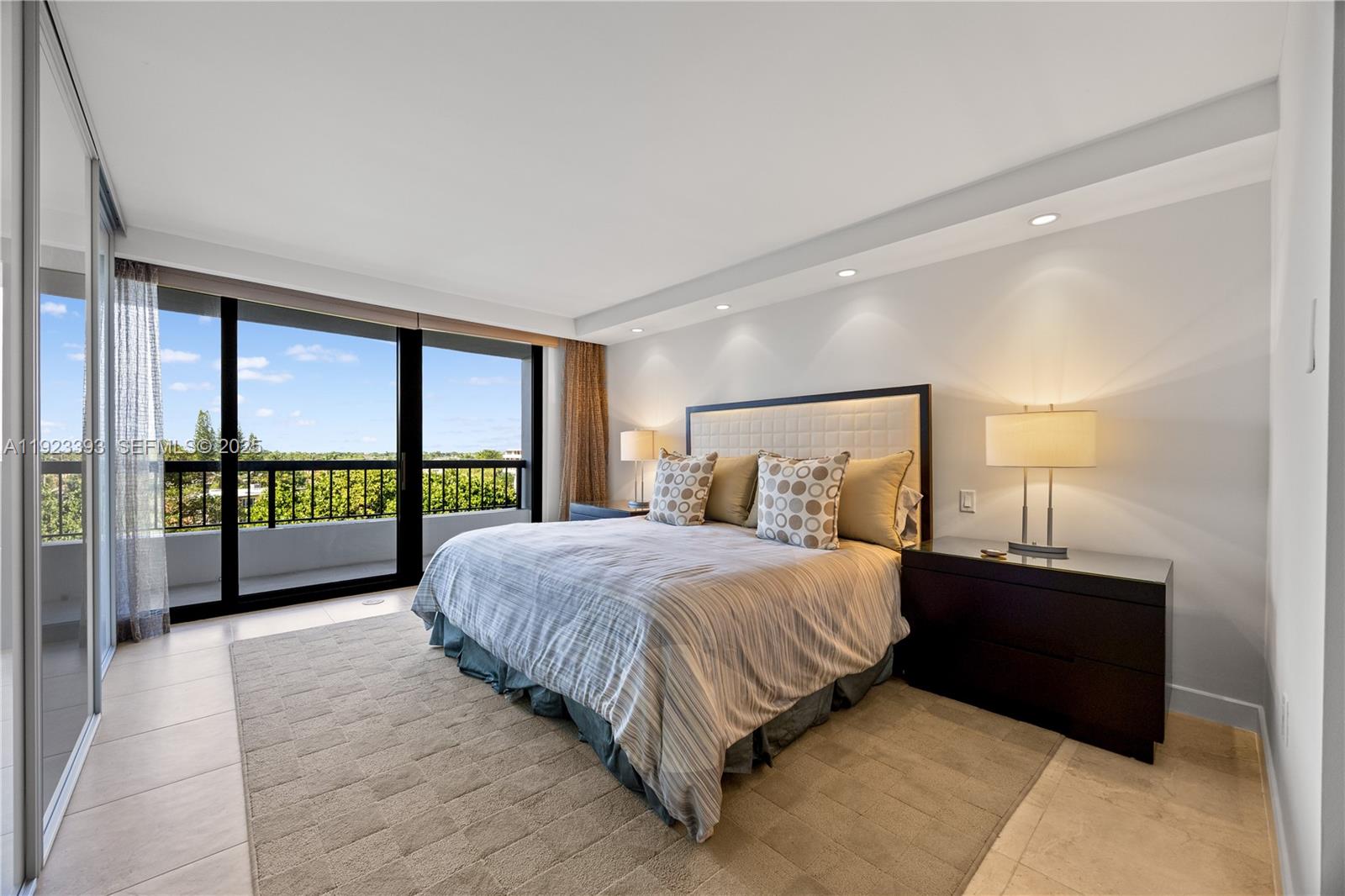 1800 South Ocean Boulevard, Unit 5C Boca Raton, FL 33432 - Photo 83 of 98 a bedroom with a large bed and a large window