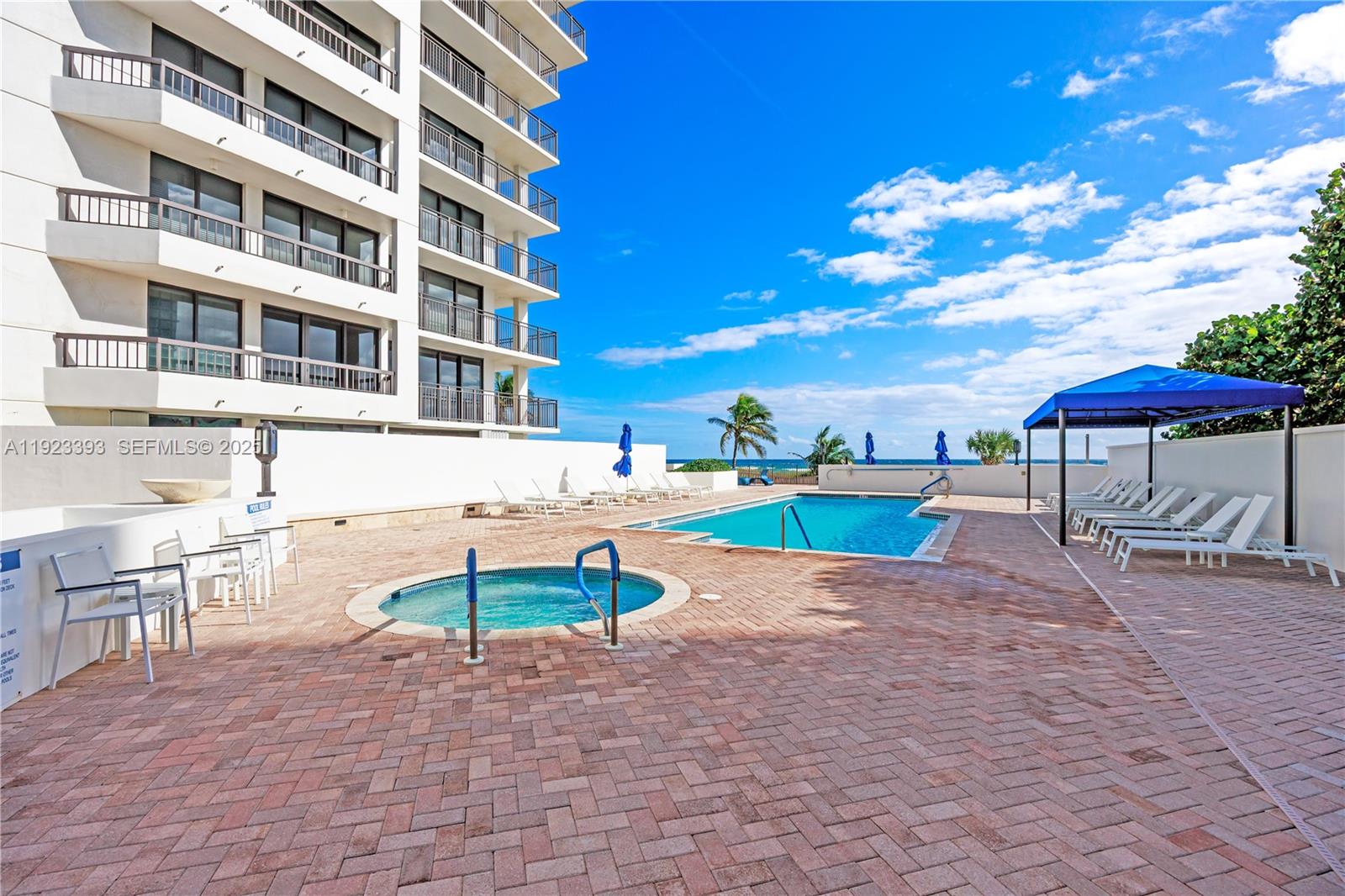 1800 South Ocean Boulevard, Unit 5C Boca Raton, FL 33432 - Photo 95 of 98 a view of a swimming pool with a patio