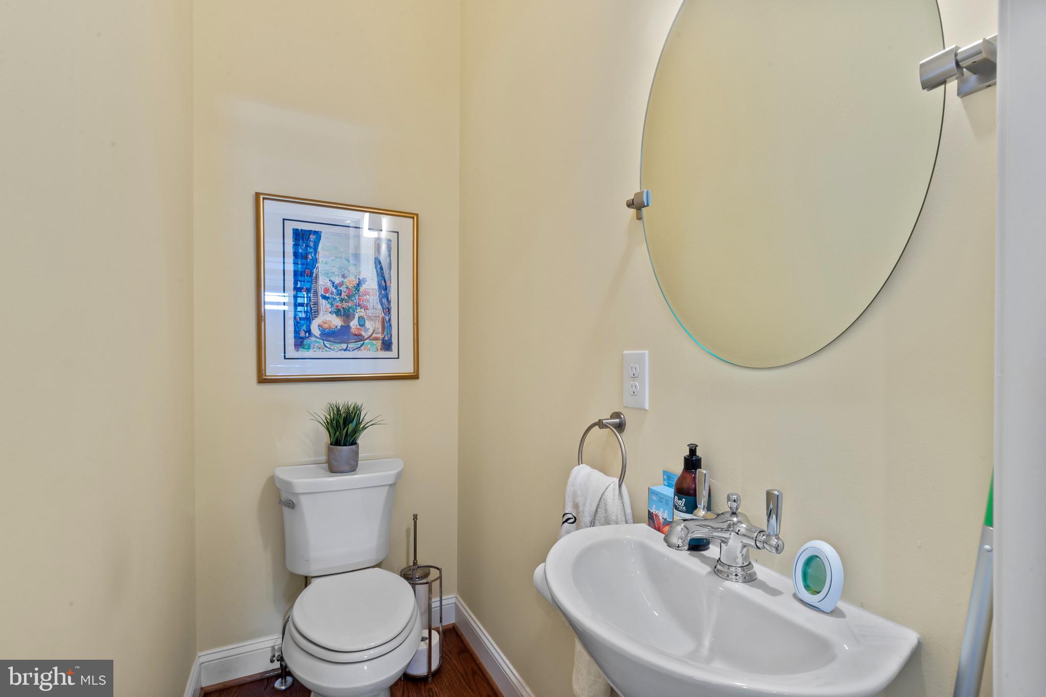 3800 Dillon Street Baltimore, MD 21224 - Photo 12 of 34 a bathroom with a sink mirror and toilet