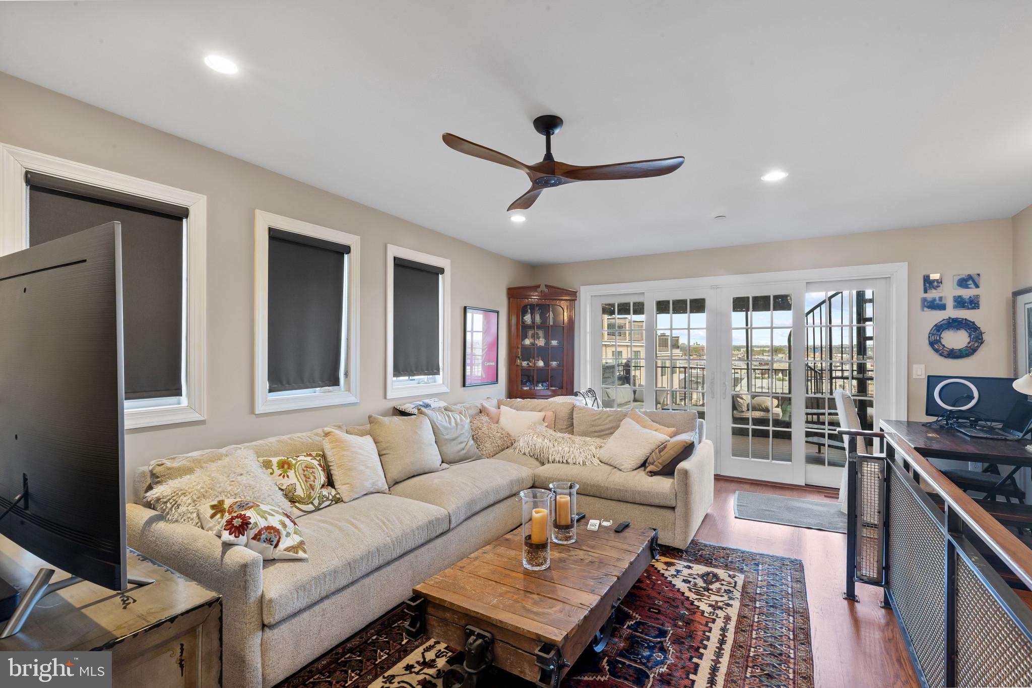 3800 Dillon Street Baltimore, MD 21224 - Photo 21 of 34 a living room with furniture and a large window