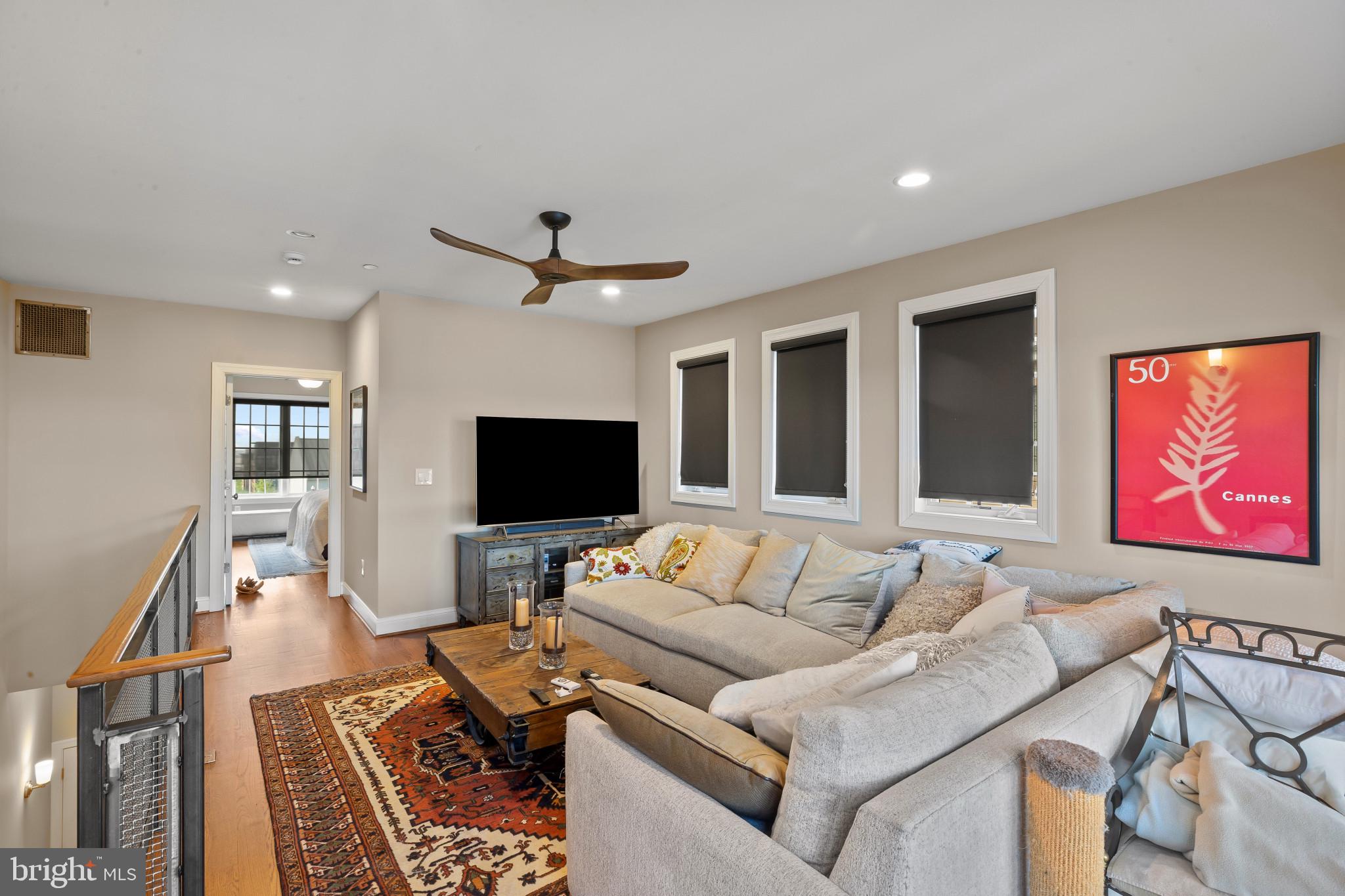 3800 Dillon Street Baltimore, MD 21224 - Photo 22 of 34 a living room with furniture and a flat screen tv
