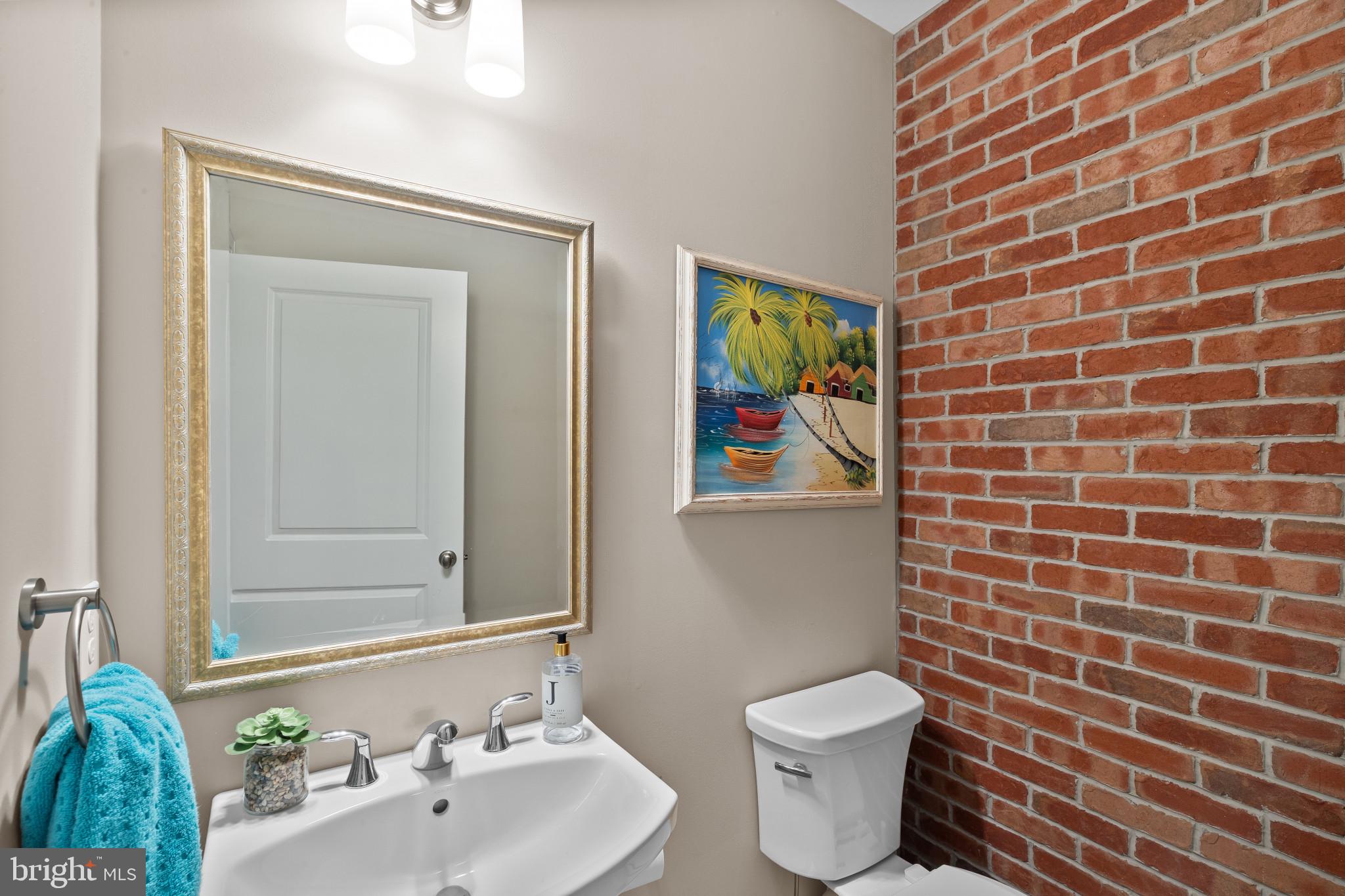 3800 Dillon Street Baltimore, MD 21224 - Photo 27 of 34 a bathroom with a sink and a toilet