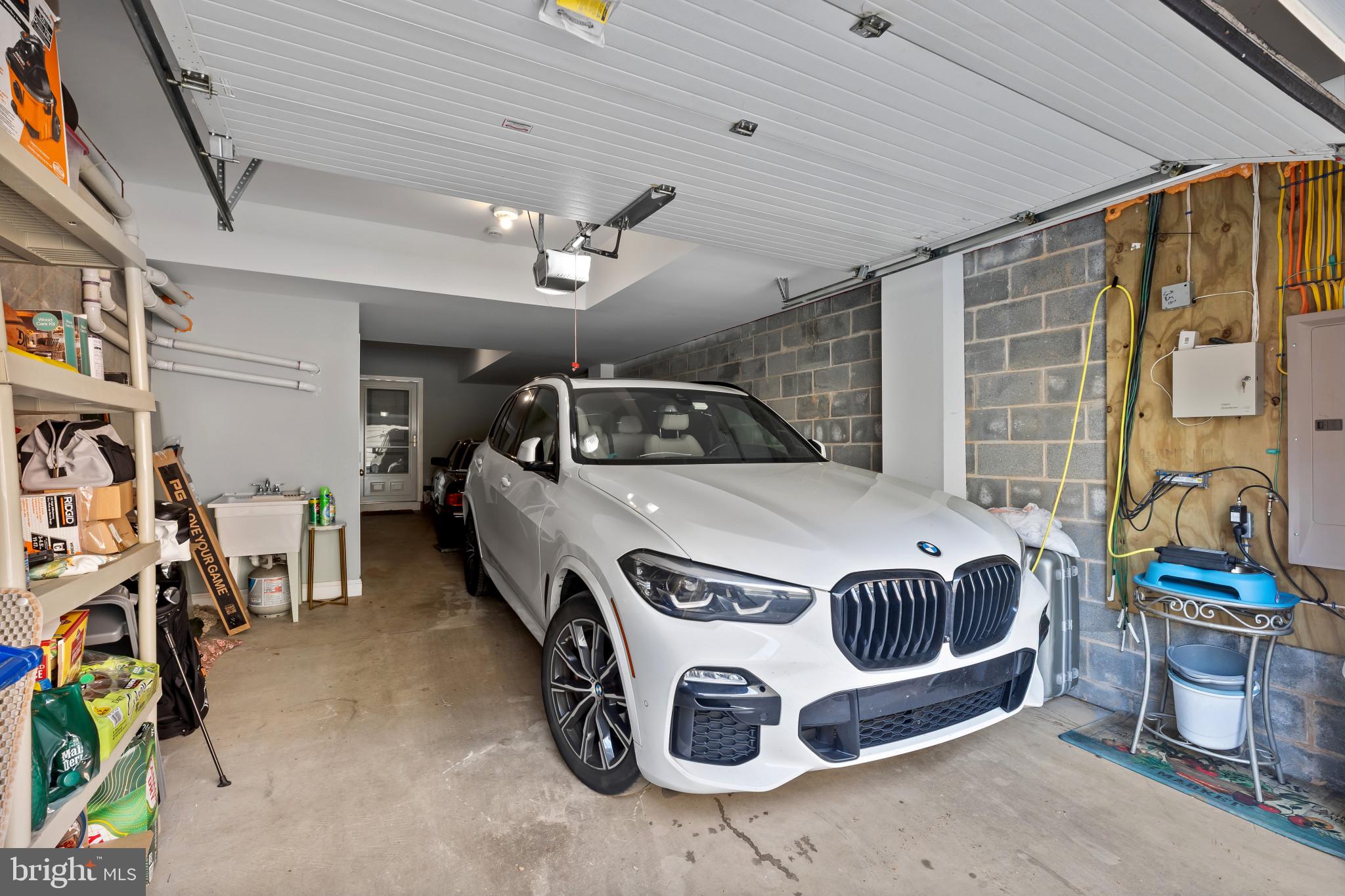 3800 Dillon Street Baltimore, MD 21224 - Photo 28 of 34 a car and bike parked in a garage