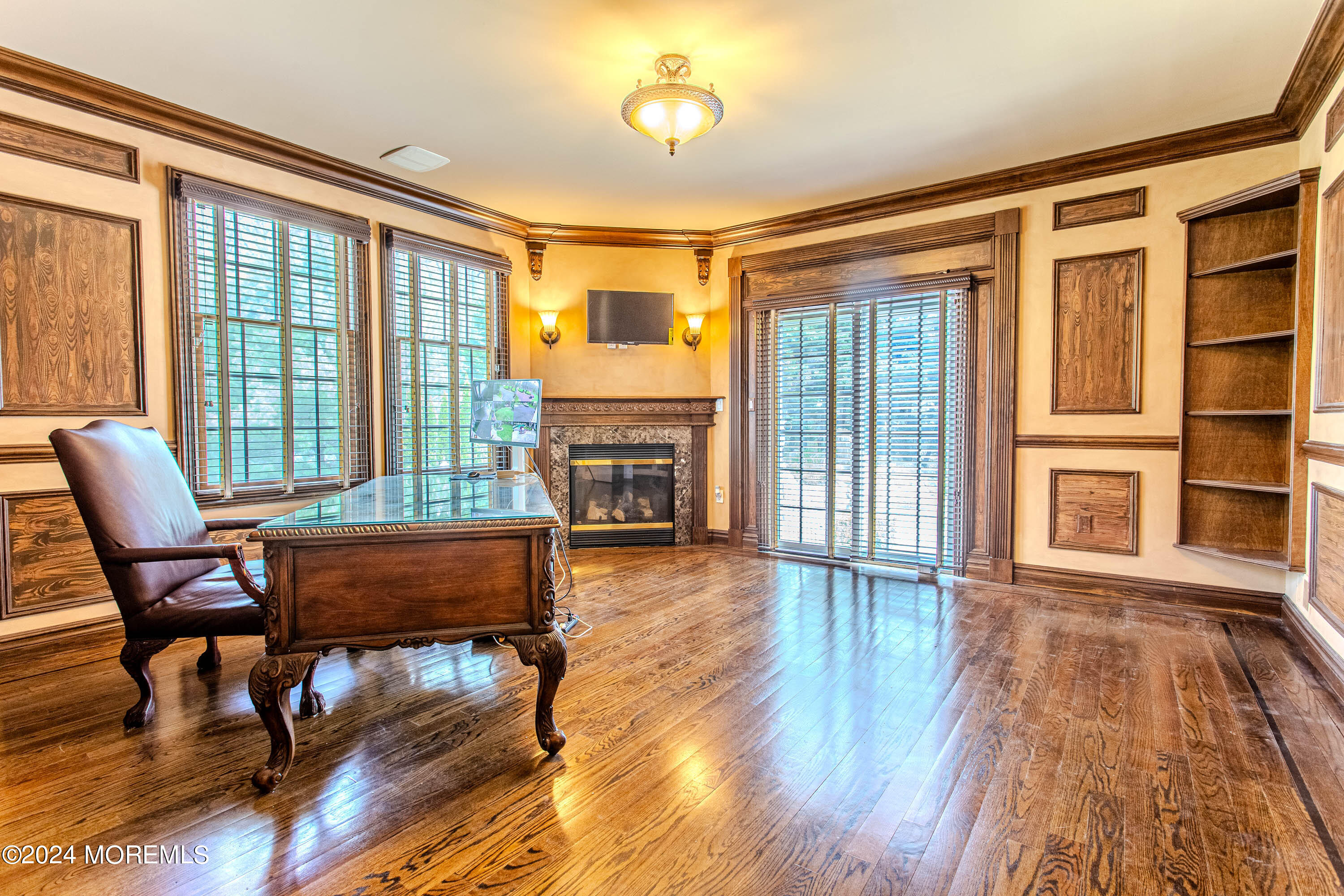 25 Woods End Road Colts Neck, NJ 07722 - Photo 14 of 76 a living room with fireplace furniture and a wooden floor