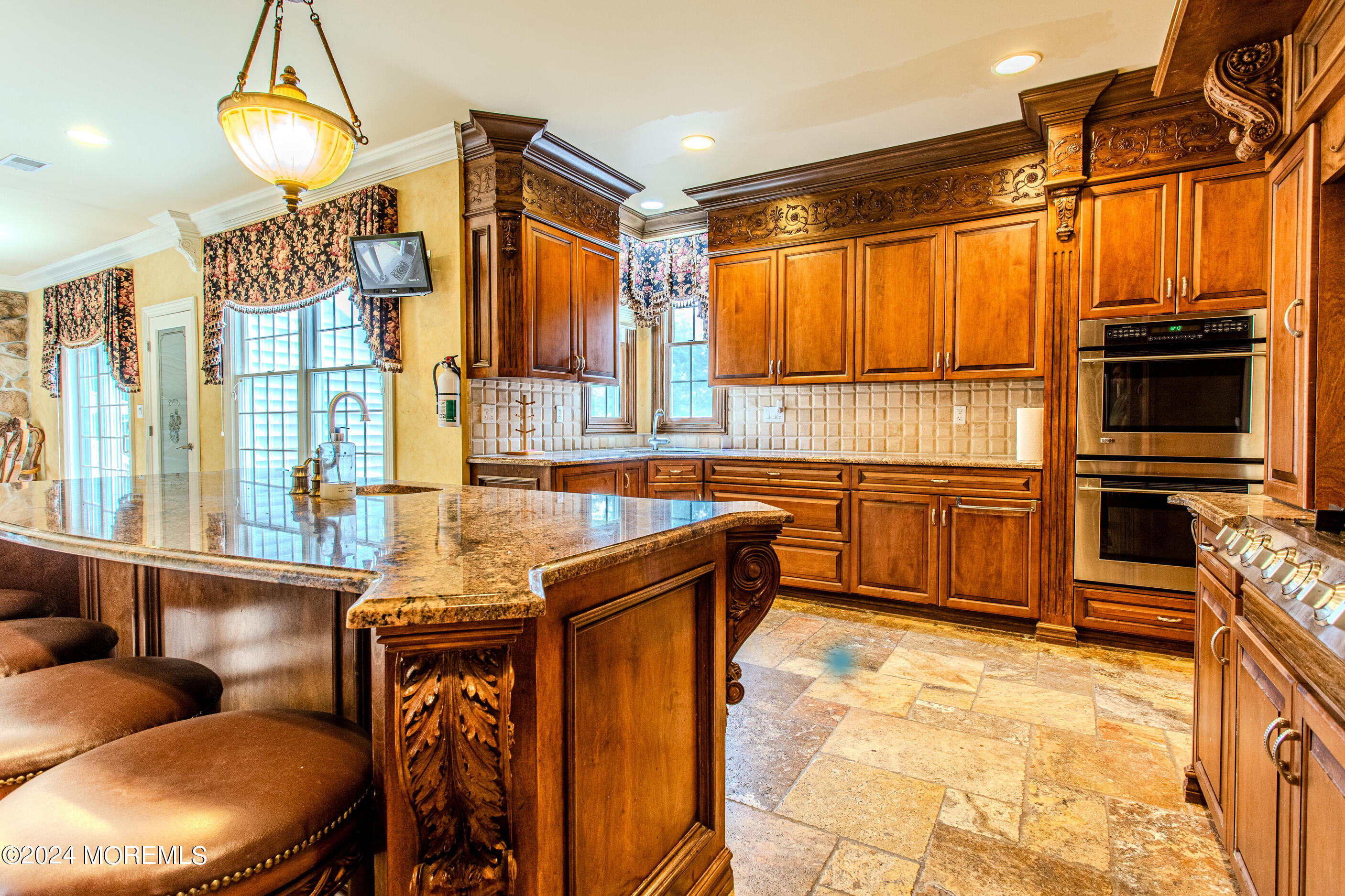 25 Woods End Road Colts Neck, NJ 07722 - Photo 16 of 76 a kitchen with stainless steel appliances granite countertop a stove a sink and a refrigerator