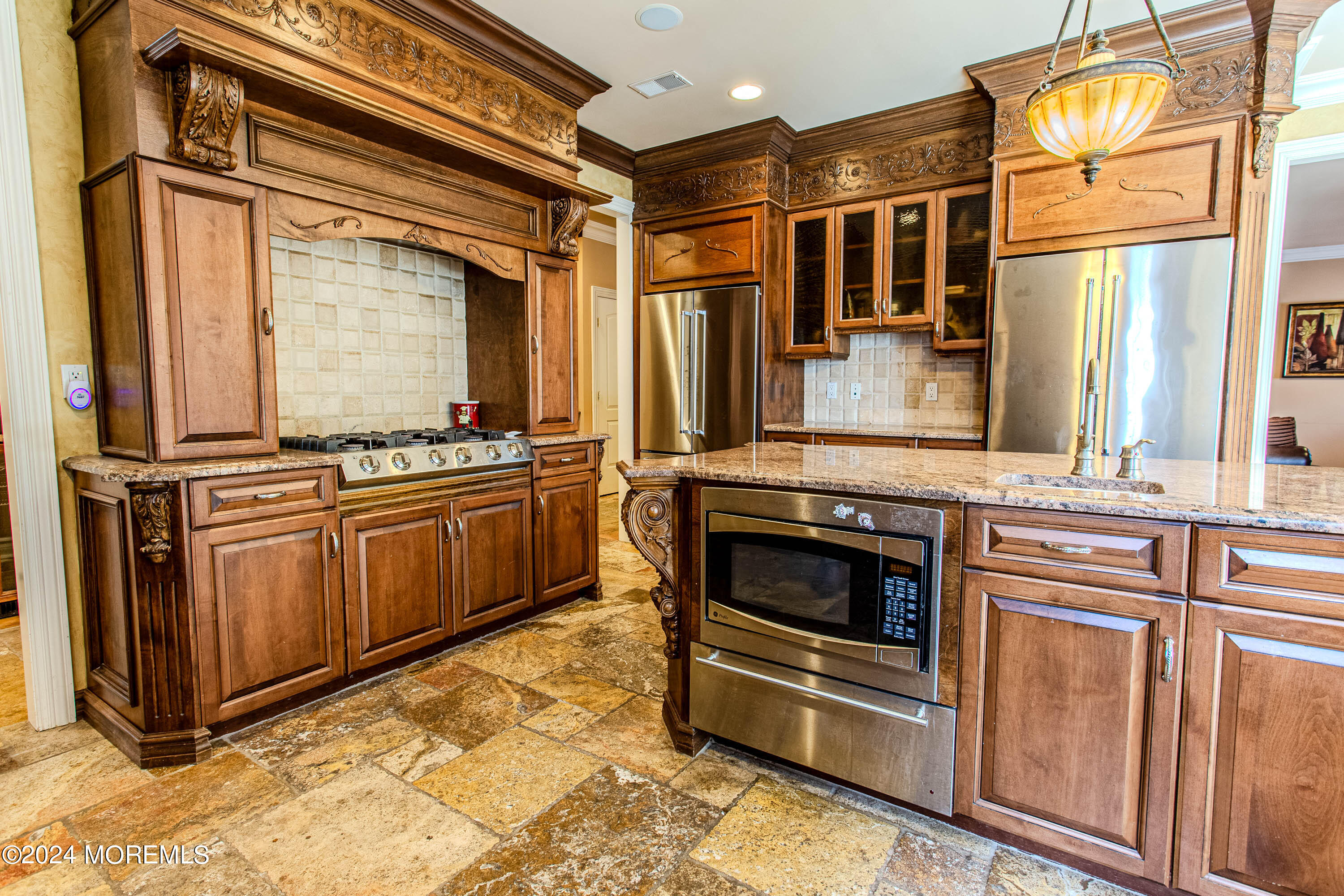 25 Woods End Road Colts Neck, NJ 07722 - Photo 17 of 76 a kitchen with stainless steel appliances a stove and a microwave