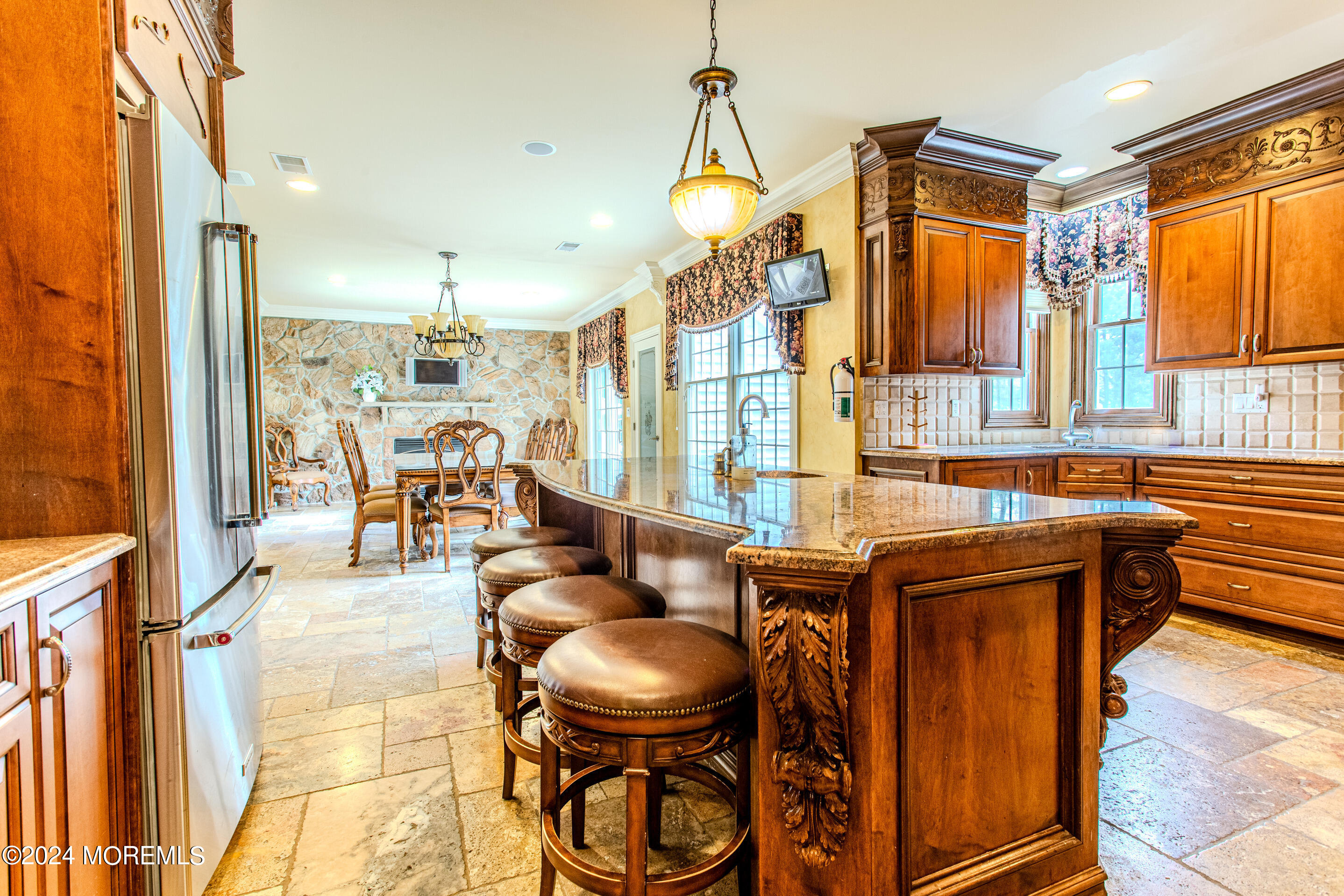 25 Woods End Road Colts Neck, NJ 07722 - Photo 20 of 76 a living room with furniture a large window and kitchen view