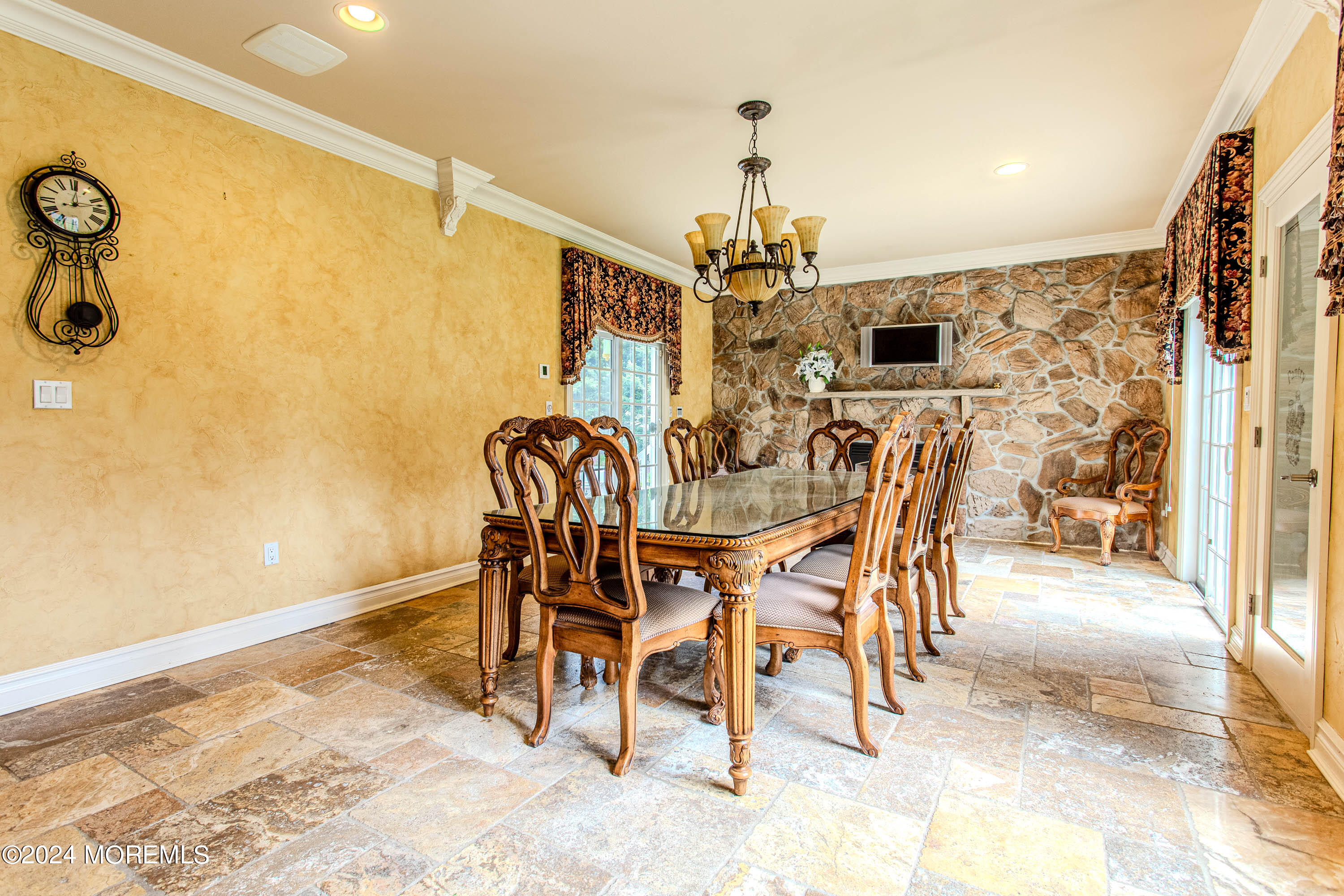25 Woods End Road Colts Neck, NJ 07722 - Photo 21 of 76 a view of a dining room with furniture and a chandelier