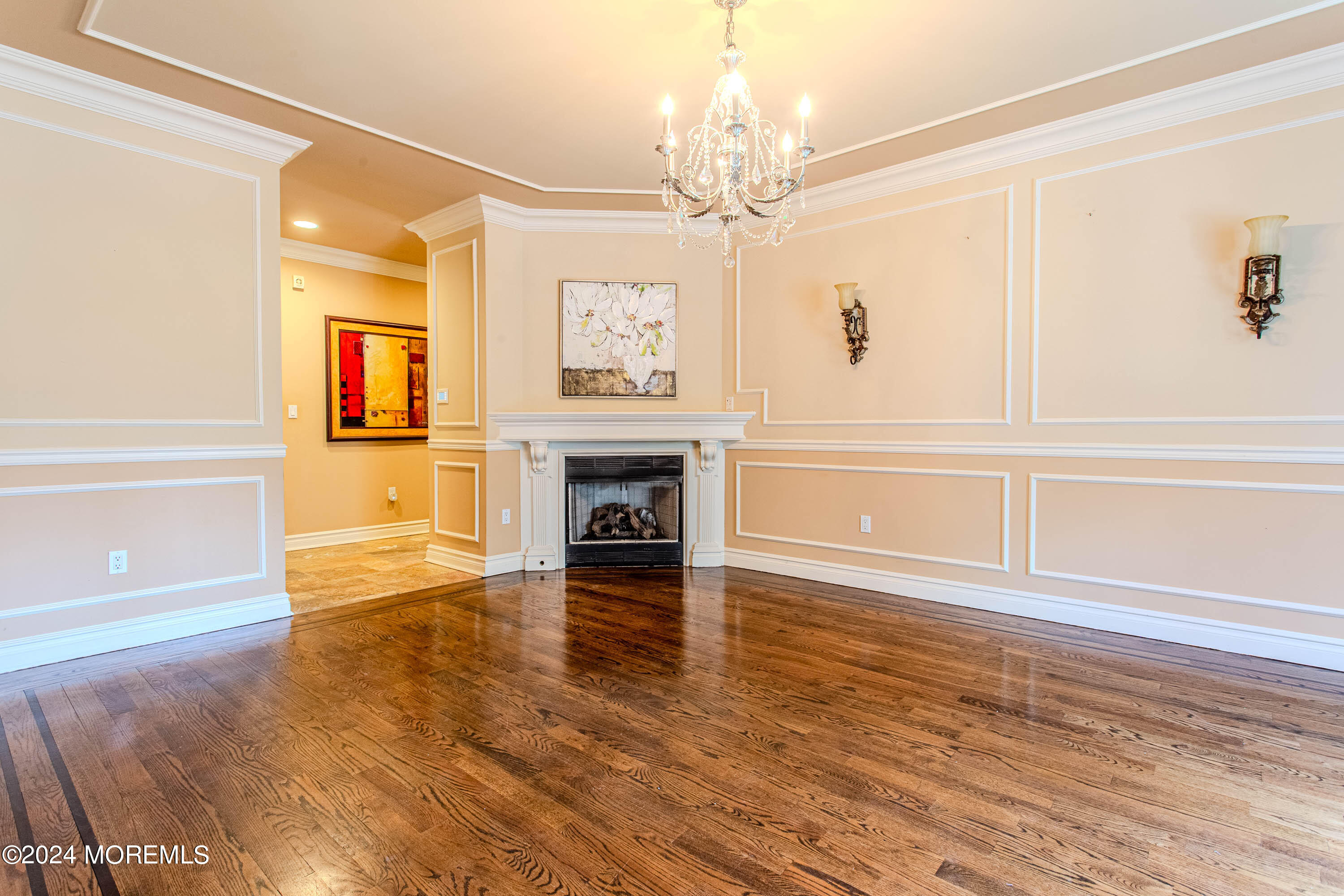 25 Woods End Road Colts Neck, NJ 07722 - Photo 25 of 76 an empty room with wooden floor fireplace and windows