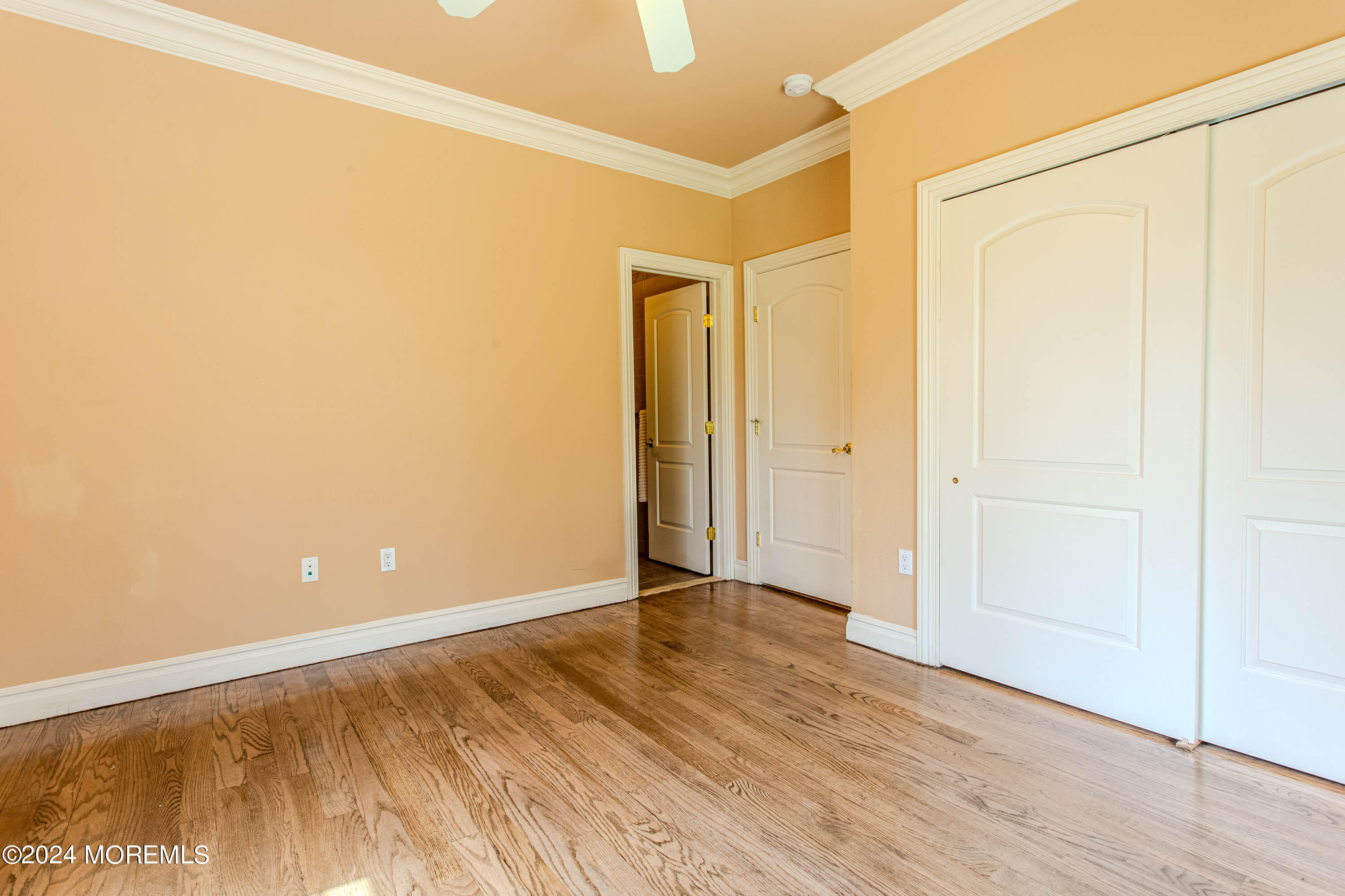 25 Woods End Road Colts Neck, NJ 07722 - Photo 27 of 76 a view of an empty room with wooden floor