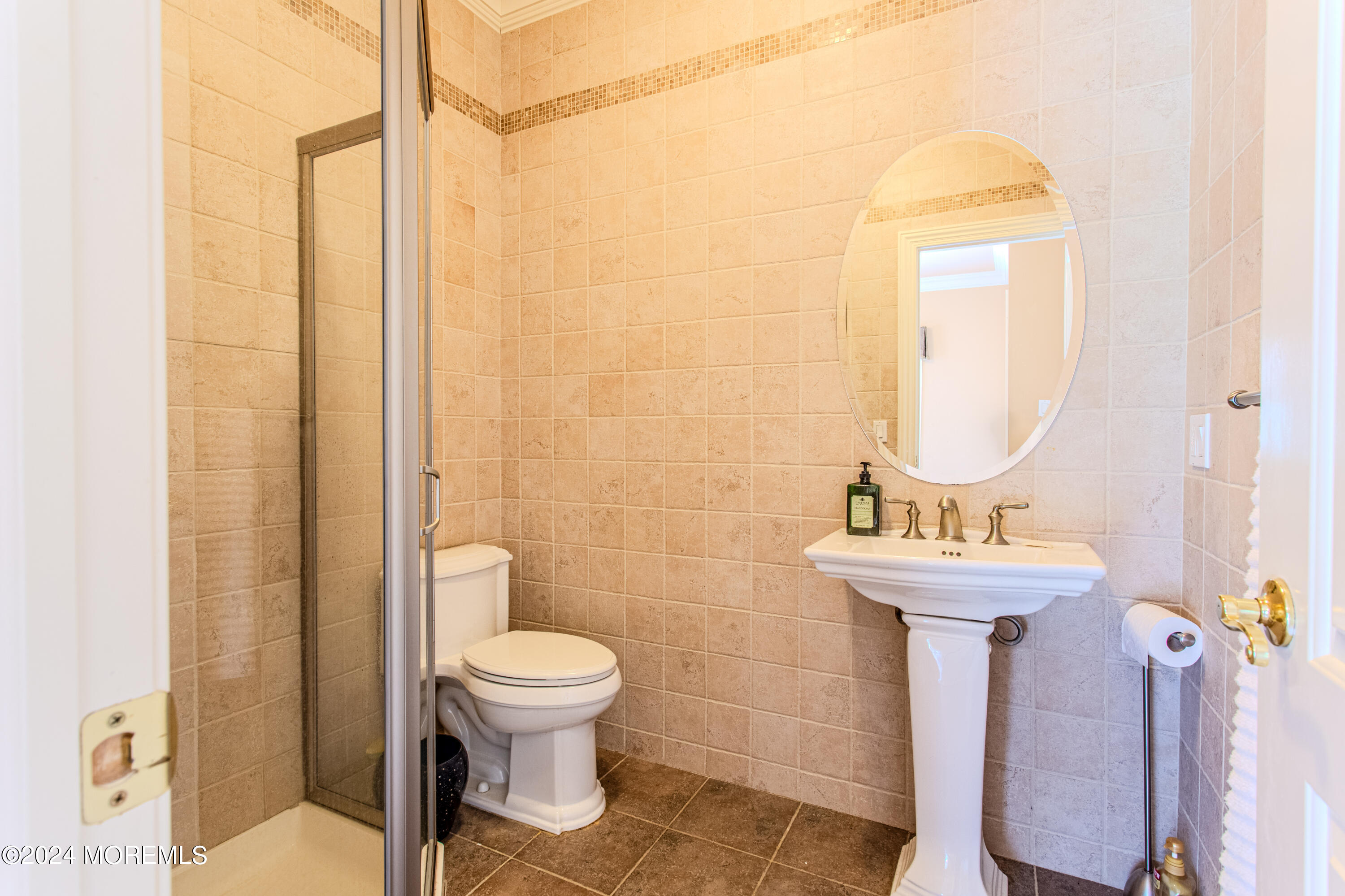 25 Woods End Road Colts Neck, NJ 07722 - Photo 28 of 76 a bathroom with a toilet a sink and a mirror