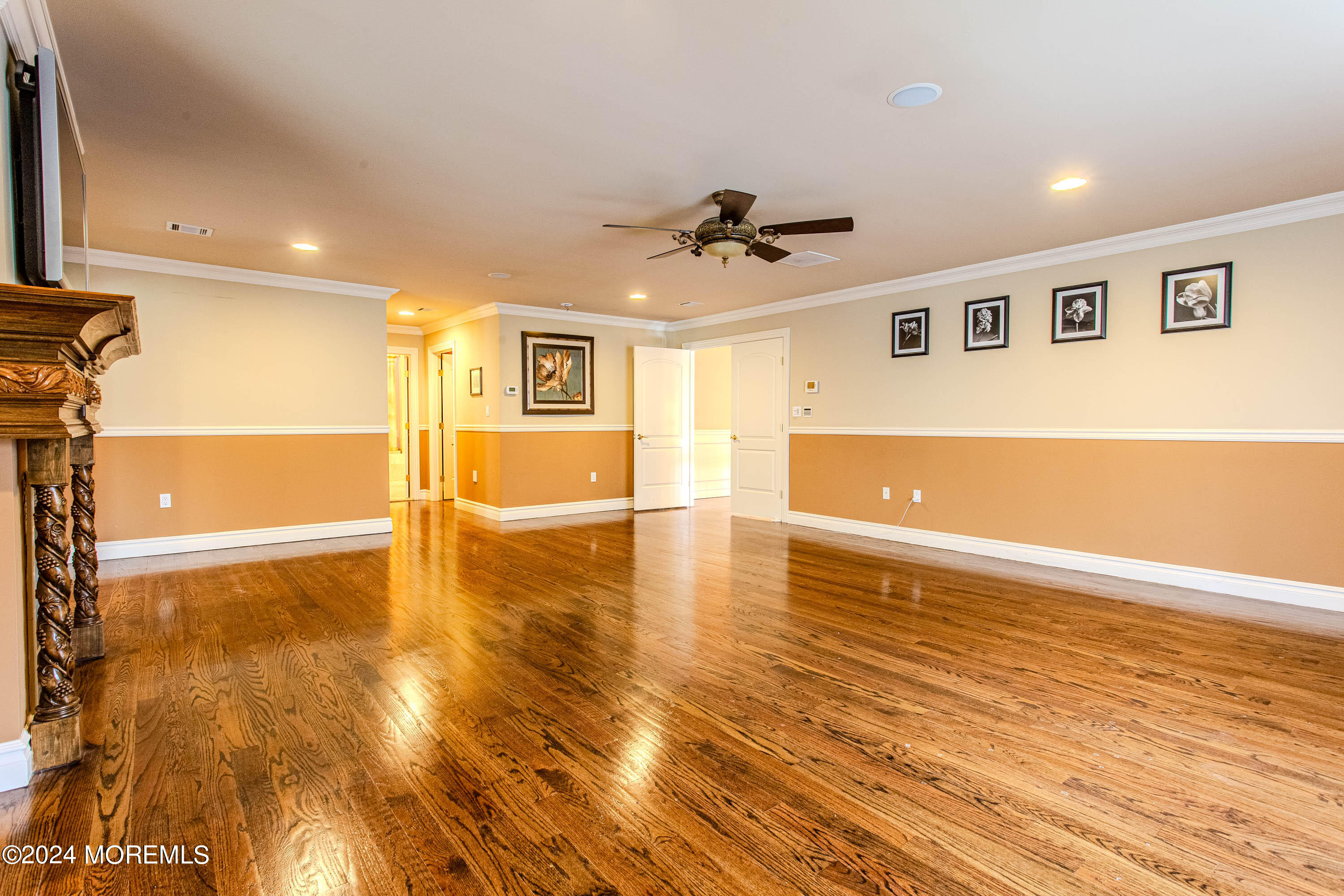 25 Woods End Road Colts Neck, NJ 07722 - Photo 34 of 76 a view of an empty room with window and wooden floor