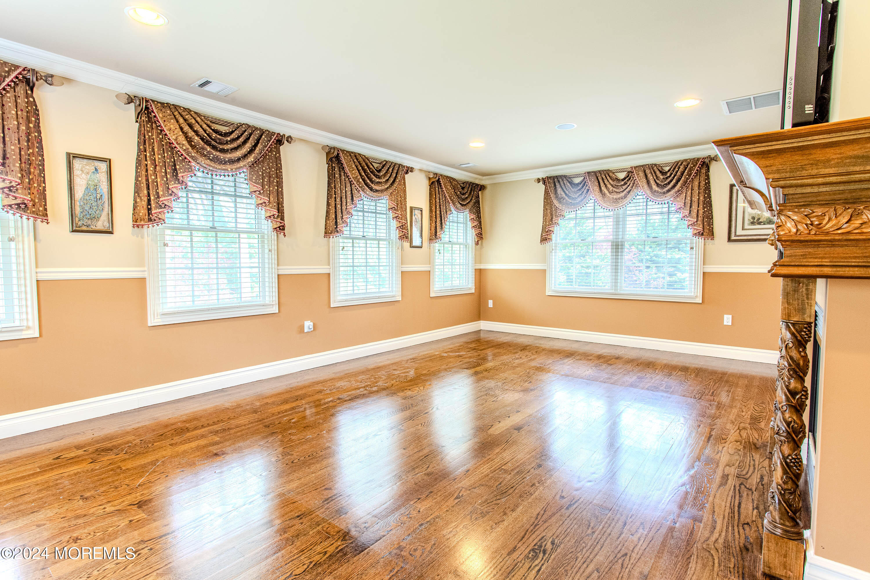 25 Woods End Road Colts Neck, NJ 07722 - Photo 35 of 76 a view of an empty room with a window and wooden floor