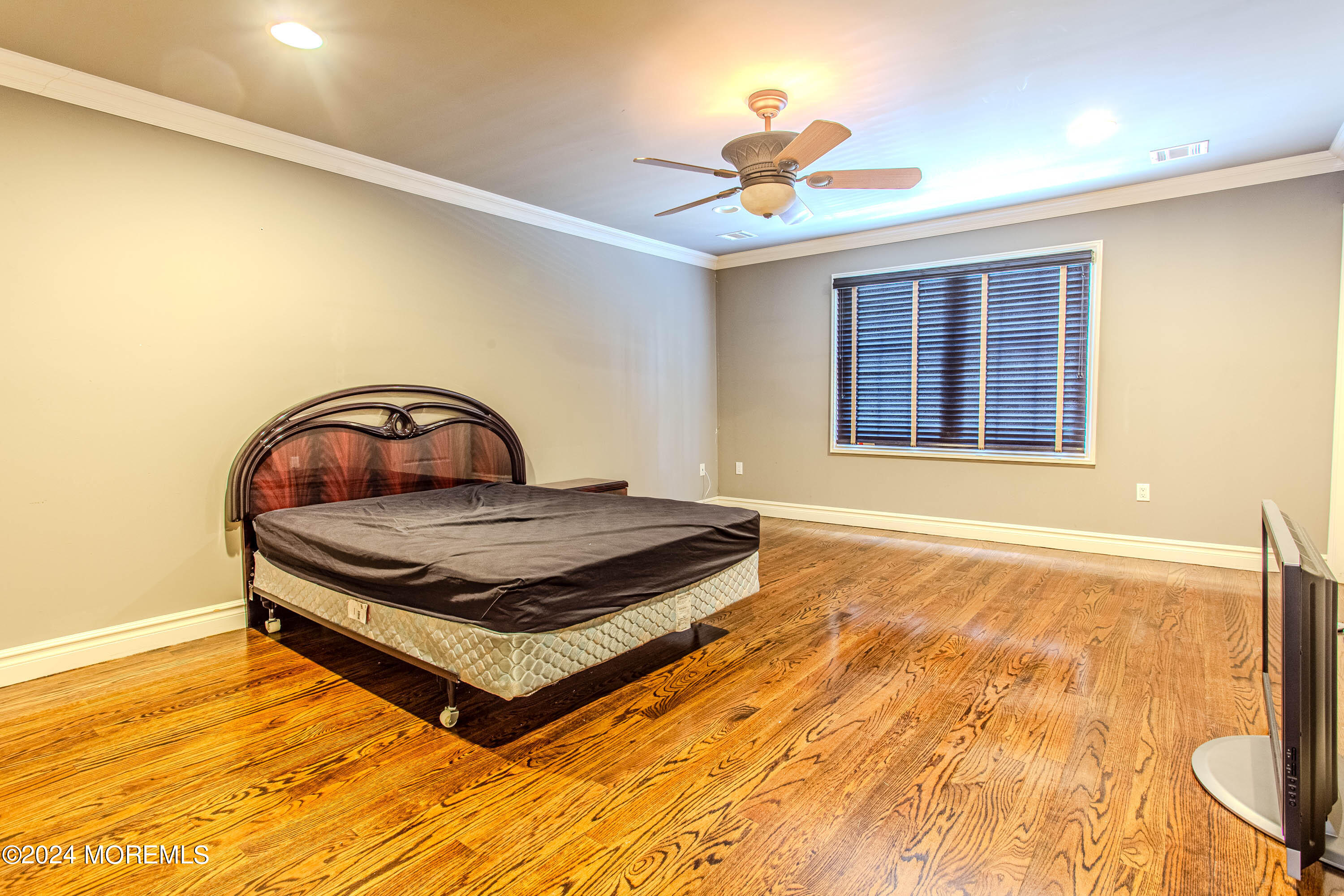 25 Woods End Road Colts Neck, NJ 07722 - Photo 42 of 76 a bedroom with a bed and a window