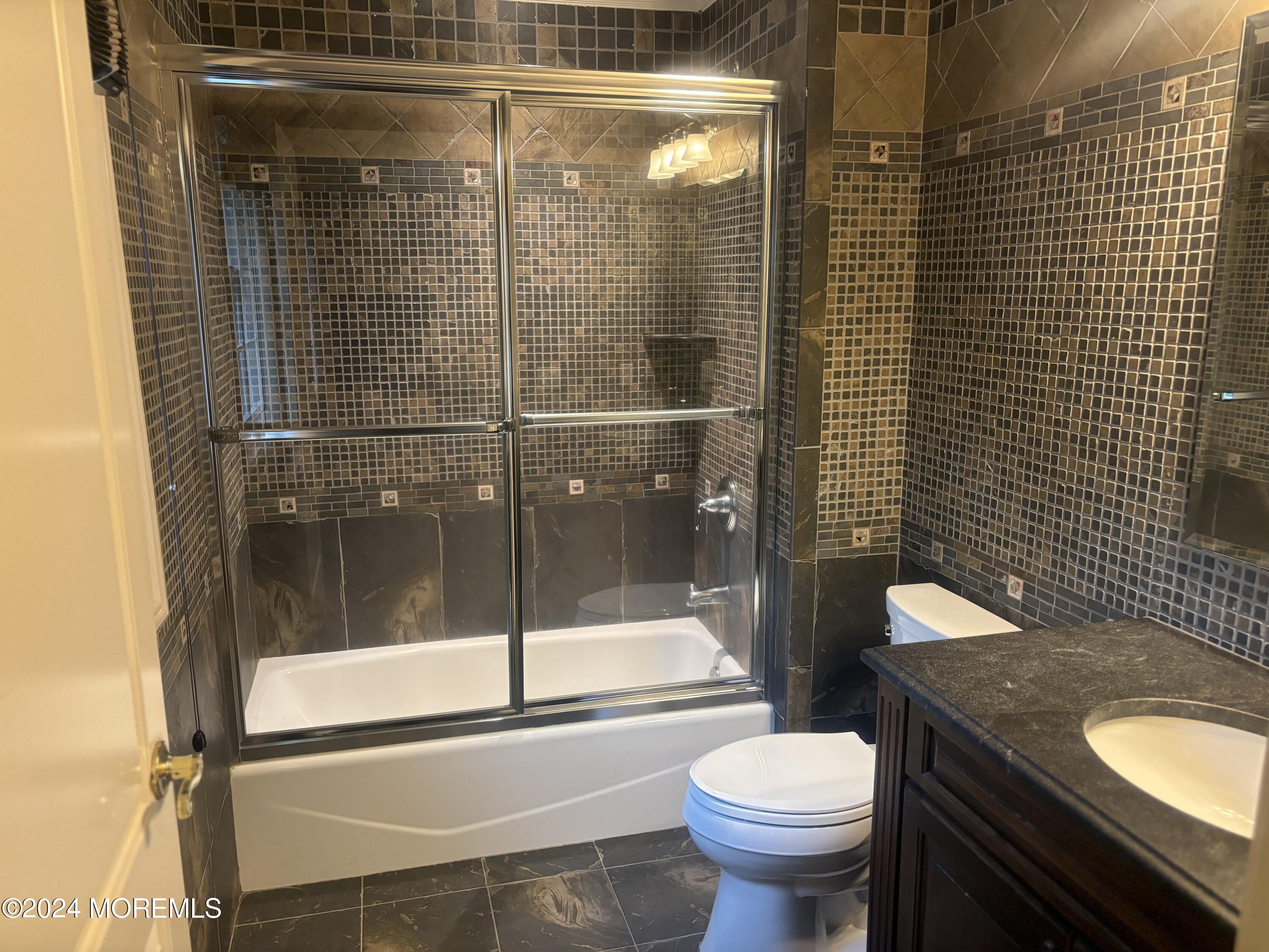 25 Woods End Road Colts Neck, NJ 07722 - Photo 44 of 76 a bathroom with a toilet and a shower