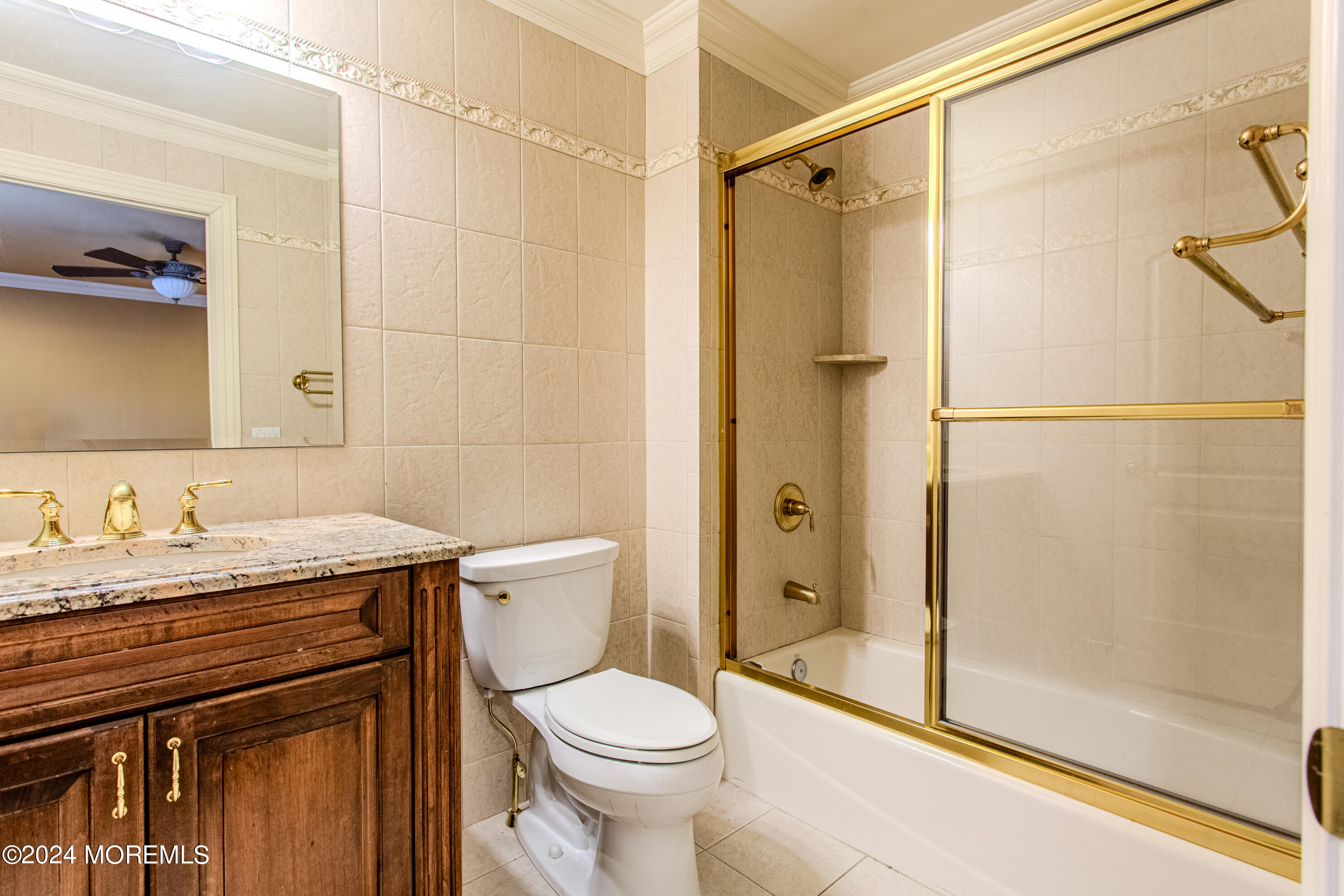 25 Woods End Road Colts Neck, NJ 07722 - Photo 49 of 76 a bathroom with a granite countertop sink toilet and shower