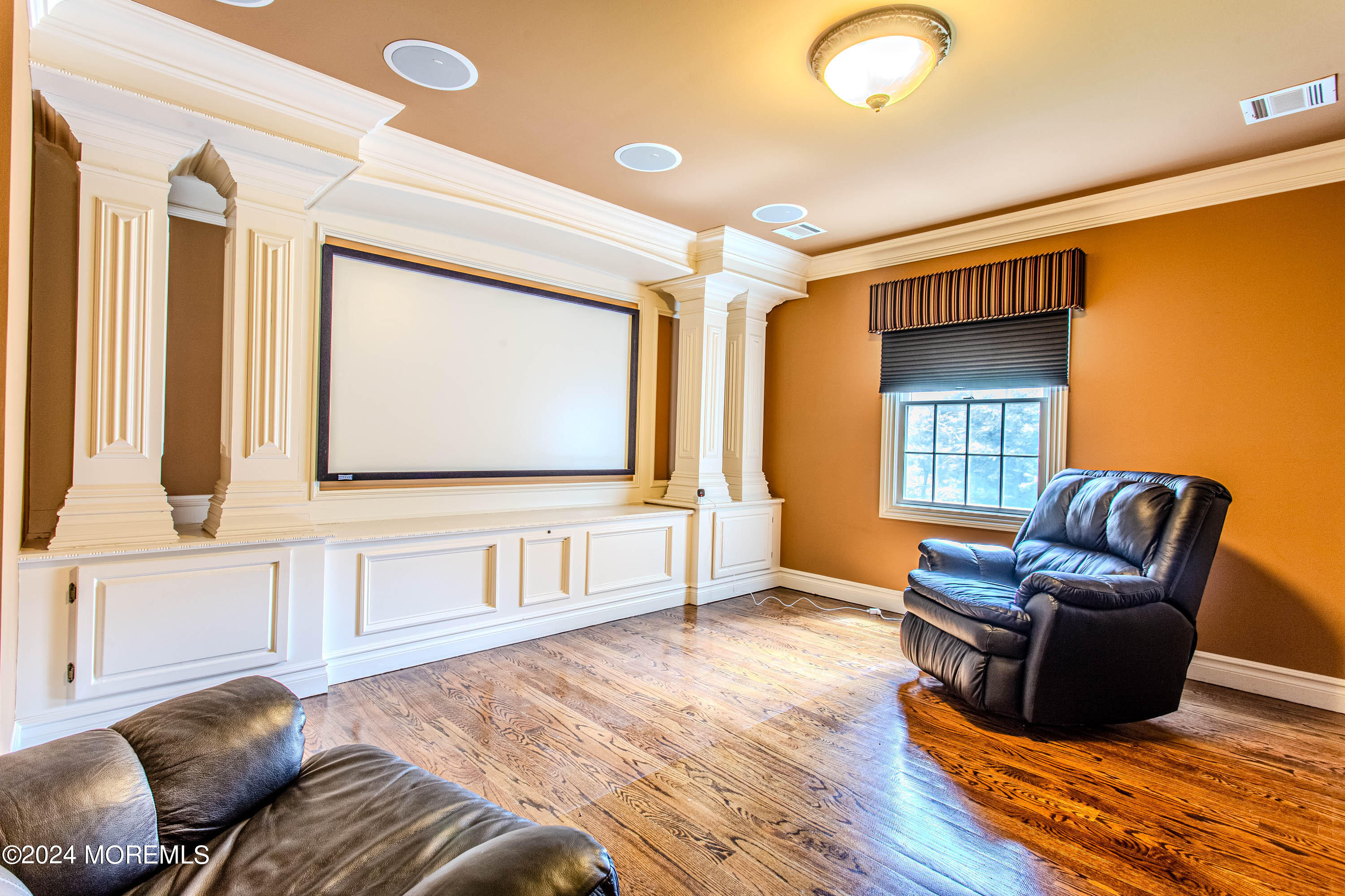 25 Woods End Road Colts Neck, NJ 07722 - Photo 50 of 76 a living room with furniture and a flat screen tv