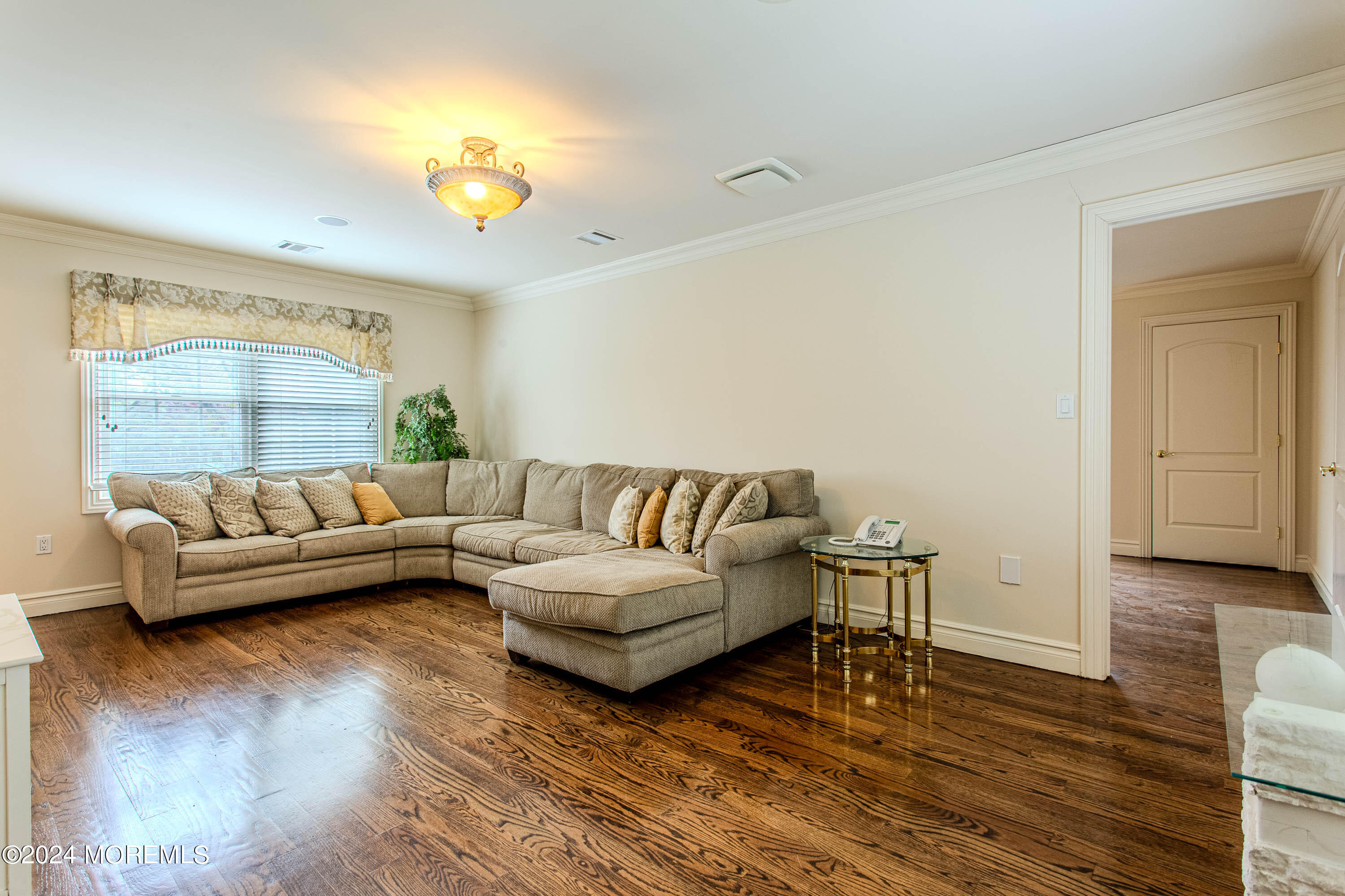 25 Woods End Road Colts Neck, NJ 07722 - Photo 55 of 76 a living room with furniture and a wooden floor