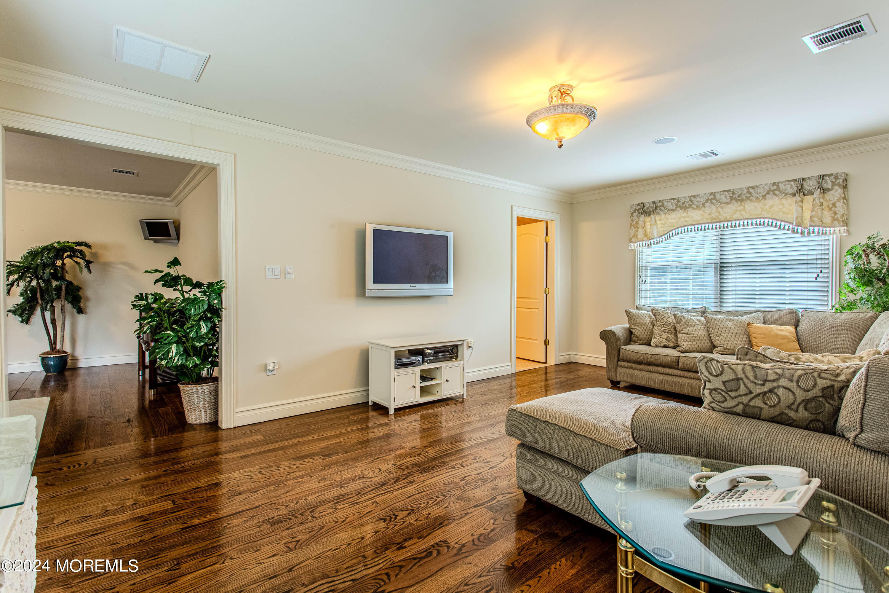 25 Woods End Road Colts Neck, NJ 07722 - Photo 56 of 76 a living room with furniture and a large window