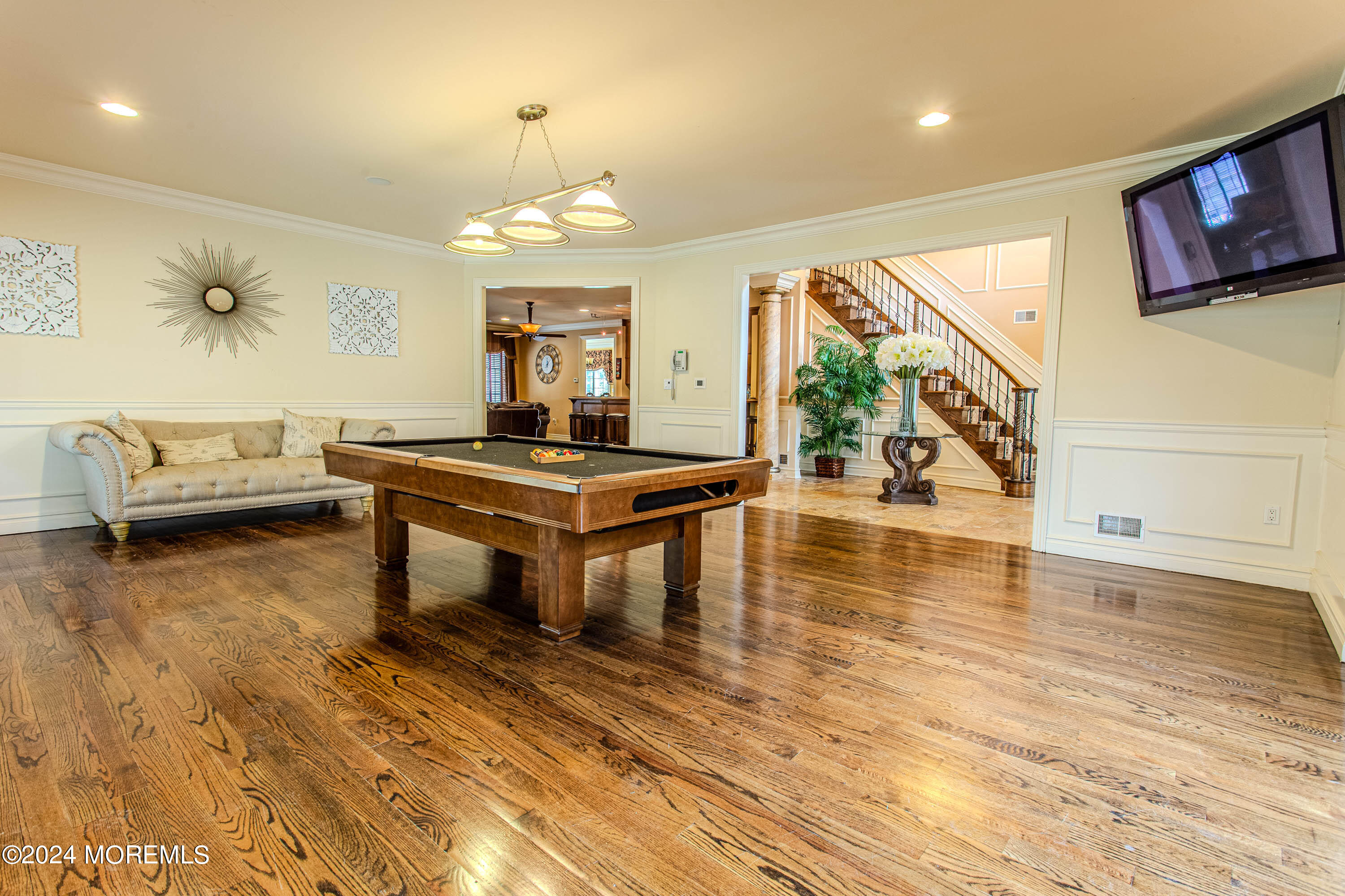 25 Woods End Road Colts Neck, NJ 07722 - Photo 8 of 76 a living room with furniture and a wooden floor