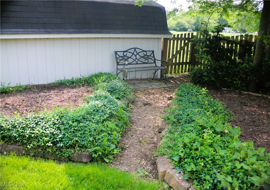 41575 Russia Road Elyria, OH 44035 - Photo 33 of 37 View of yard featuring landscaping
