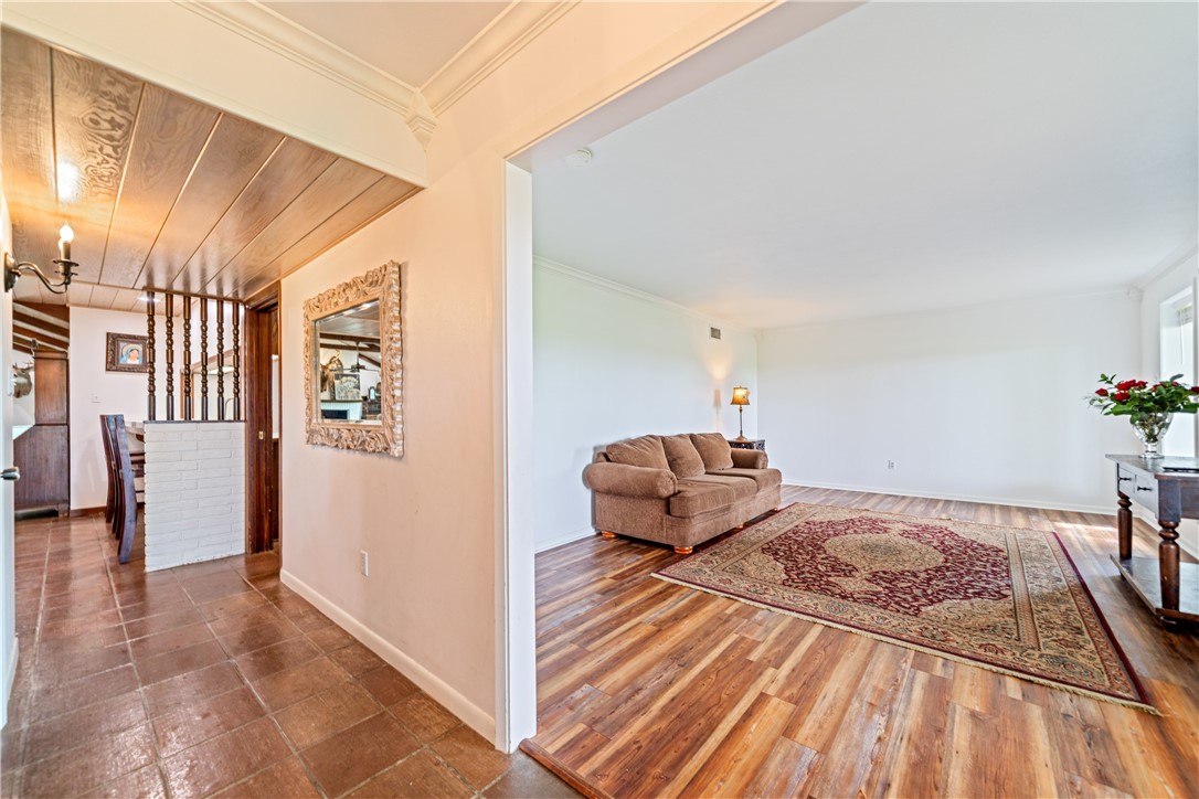 501 South County Road 1140 Riviera, TX 78379 - Photo 4 of 40 Spacious formal living room featuring wood-look fl
