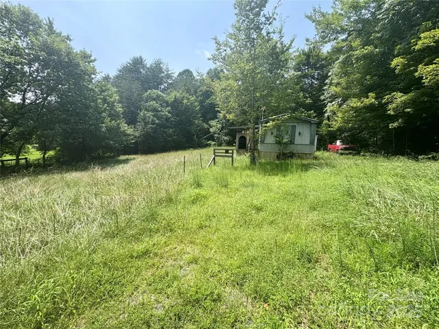 a backyard of a house with lots of green space