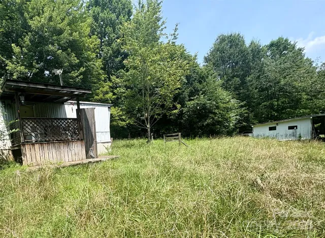 a backyard of a house with lots of green space