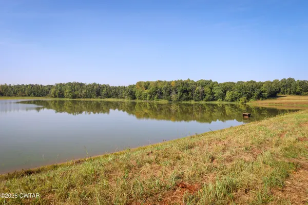 a view of a lake with houses in the back
