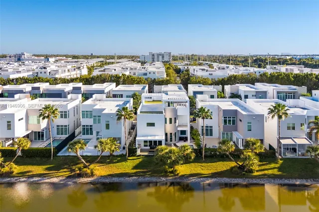 an aerial view of residential houses with outdoor space