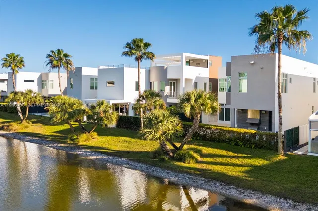 a front view of a house with swimming pool yard and outdoor seating