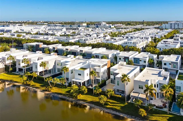 a front view of a house with outdoor seating