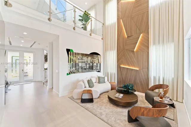 a bedroom with furniture and a large window