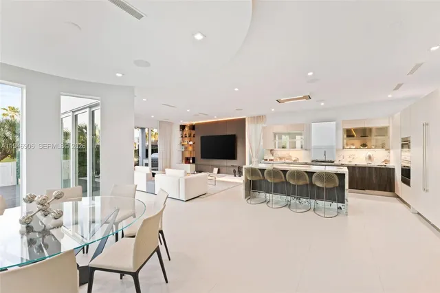 a living room with furniture wooden floor and a flat screen tv
