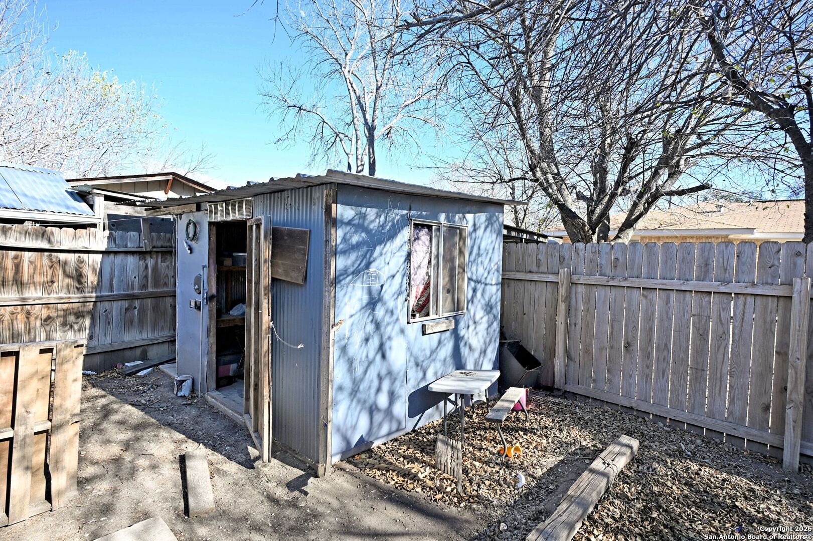 2229 Michigan Street New Braunfels, TX 78130 - Photo 17 of 19 a view of a wooden house with a large tree