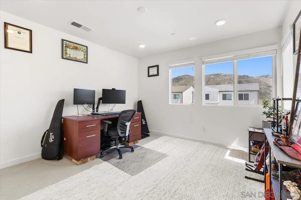 108 Lipizzan Lane Fallbrook, CA 92028 - Photo 15 of 37 a view of a workspace with furniture and a window