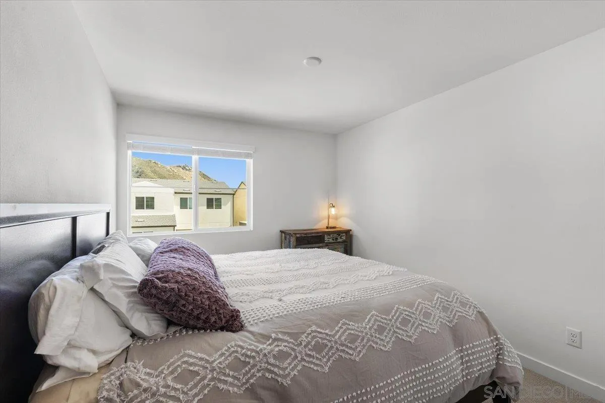 108 Lipizzan Lane Fallbrook, CA 92028 - Photo 24 of 37 a bedroom with a bed and a window
