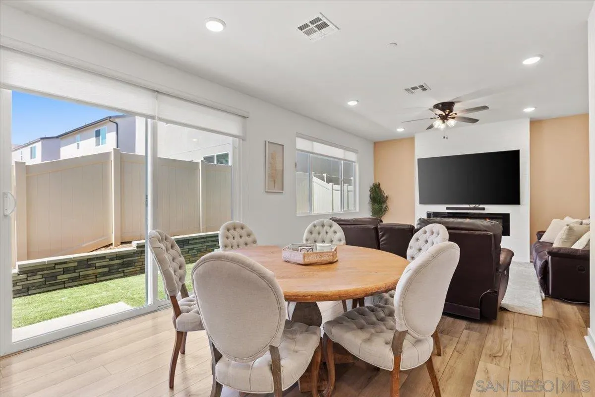 108 Lipizzan Lane Fallbrook, CA 92028 - Photo 6 of 37 a view of a dining room with furniture window and wooden floor