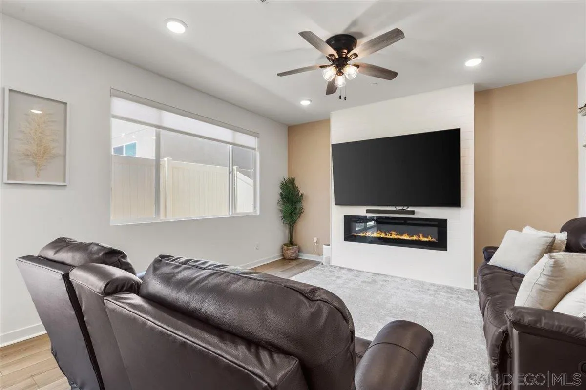 108 Lipizzan Lane Fallbrook, CA 92028 - Photo 8 of 37 a living room with furniture and a flat screen tv
