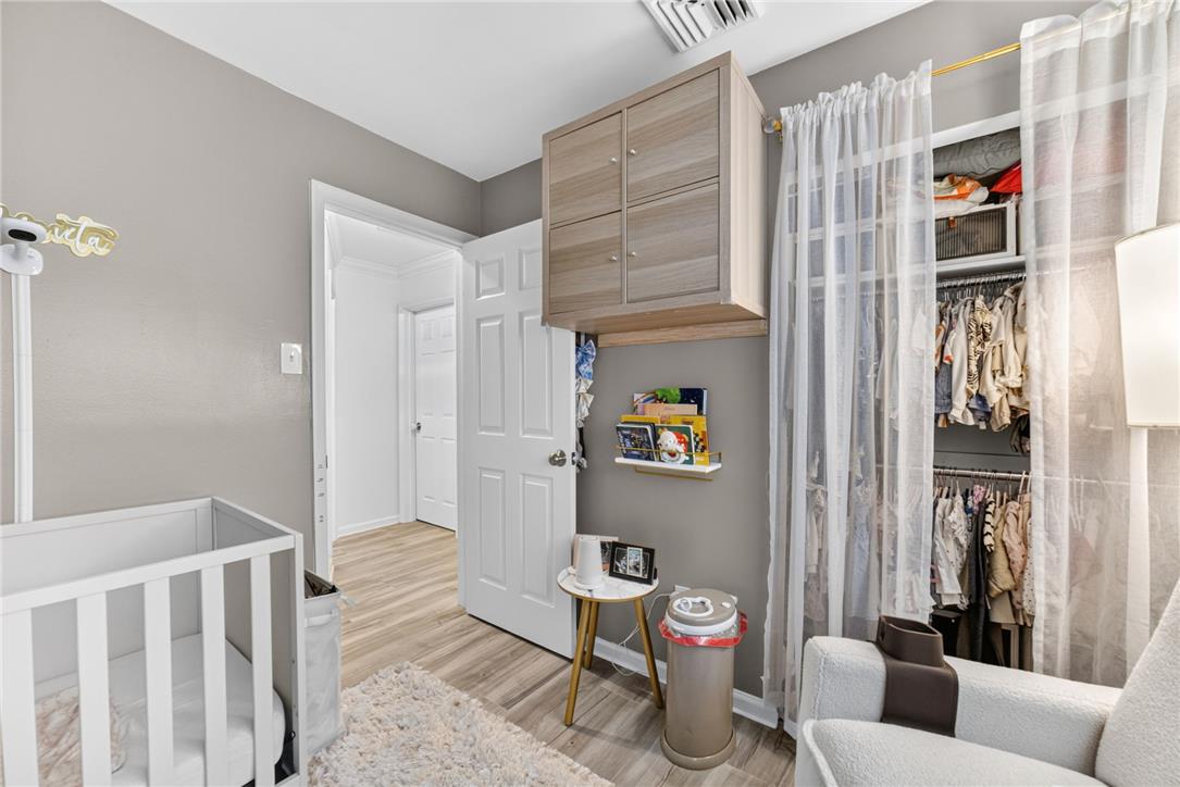 7290 Heather Road Macungie, PA 18062 - Photo 30 of 39 Well-lit nursery featuring durable plank flooring and a conveniently organized closet space.