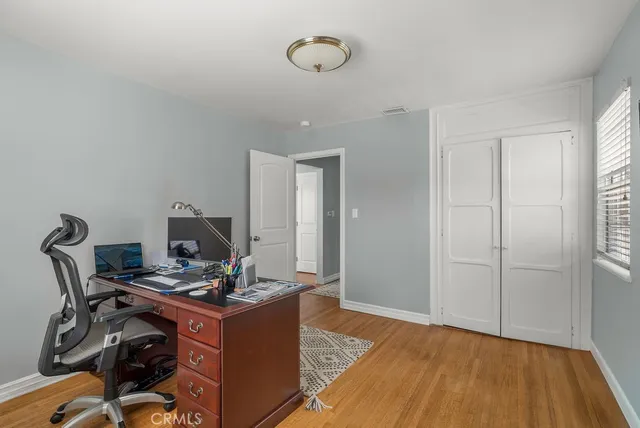 a view of workspace with wooden floor