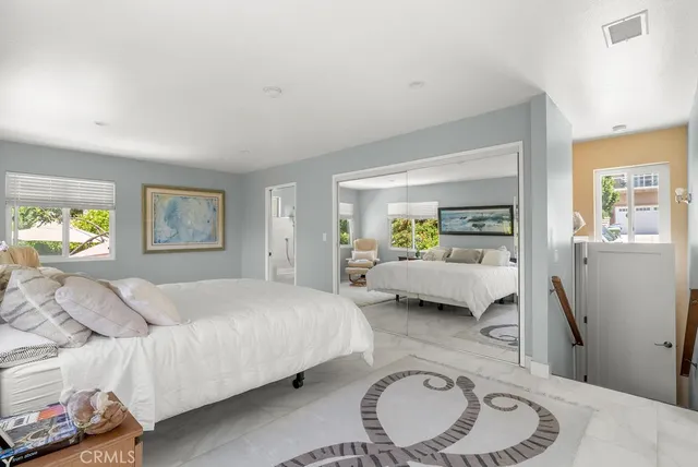 a bedroom with a bed and a couch