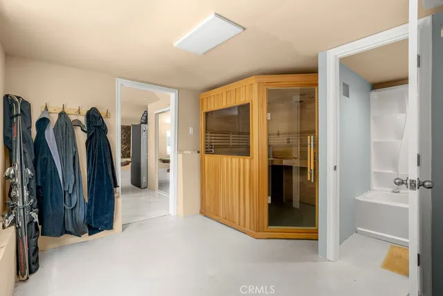 a view of a walk in closet and bathroom